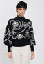 Maglione nero con ricami floreali bianchi e dettagli in paillettes
